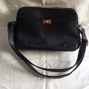 Black shoulder bag with gold accents